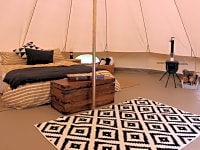 Bell tent with woodburning stove, logs and bed Bell tent with woodburning stove, logs and bed