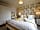 Madryn Castle Holiday Park: Master bedroom with ensuite bathroom (photo added by manager on 25/03/2023)