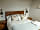 Wolds Wine Estate: Bedroom with double bed and luxury linens