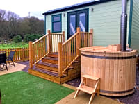 Woodfired hot tub: relax and unwind in the soothing hot waters Woodfired hot tub: relax and unwind in the soothing hot waters