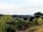 Hendre Farmhouse Orchard Campsite: View of pond from pitch