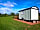 South Ford Farm Camping: A side view of the shepherd's hut Olive