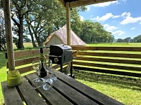 Barbecue and picnic table under cover Barbecue and picnic table under cover