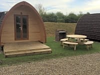 Family pod with table and barbecue Family pod with table and barbecue