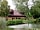 Wassell Grove Camping and Caravanning: Facilities building by the lake