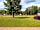 Talladega Pit Stop RV Park and Campground: Grassy pitches with trees