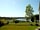 Camping des Lacs: Grass pitch with a view of the lake