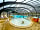 Camping Le Kergariou: Swimming pool complex with view of the paddling pool