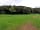 Mains Farm Camping and Caravan Site: Field opposite of the road, with nice wood land (photo added by manager)