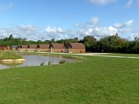 Our grass touring/tent pitches located alongside our lake. Our grass touring/tent pitches located alongside our lake.