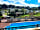 Calloose Caravan Park: View of the pool and park from the sun lounge spot