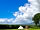 Toghill House Farm: Day snap of one of the tents, firepit and kitchen/ bathroom area