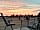 The Huddle at Big Sky: Seating area at sunset