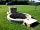 Broadmeadow: central firepit with barbecue for campers use.