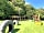 Haywood Farm Caravan and Camping Park: Play area with den, slide, swings, climbing frame and boat sand pit - great fun!