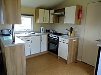 Kitchen in the two-bedroom static caravan Kitchen in the two-bedroom static caravan