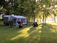 Lakeside grass pitch with optional electric hook-up Lakeside grass pitch with optional electric hook-up