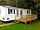 Camping La Kilienne: Decked terrace (photo added by manager on 13/10/2015)