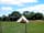 Moonacre Alpacas: The bell tent has its own enclosure with a kitchen station and eco loo. Shower and toile in the barn