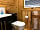 Coiltie Glampod: Bathroom with a toilet, basin and full-sized shower (photo added by manager on 06/04/2022)