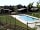 Càmping Rural Montori: Pool view with villas around
