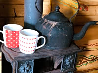 Boil the kettle on the fire inside or outside Boil the kettle on the fire inside or outside