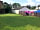 Inn at the Bush: A well-drained grass area adjacent to the car park, with picnic tables for each pitch (photo added by manager on 08/04/2020)