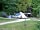 Camping Le Repaire: Pitches surrounded by trees
