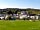 Castle Point Caravan Site: A view of the site and farmhouse (photo added by manager on 23/06/2015)