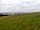 Golden Sands Holiday Park: Green space next to pods, nice view of sea