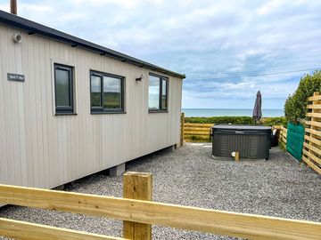 Parking area, hot tub and sea views